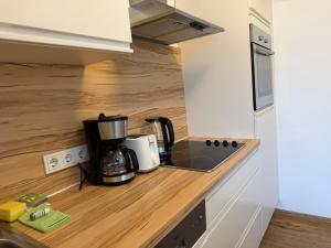 a kitchen with a coffee maker on a counter at Kaprun 1 in Kaprun