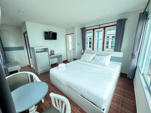 Postel nebo postele na pokoji v ubytování The Iris Resort + 23 fotografií