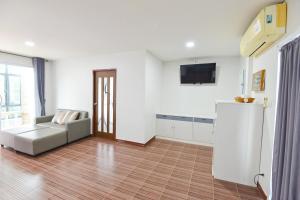 TV a/nebo společenská místnost v ubytování The Iris Resort