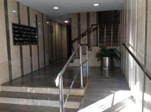 a staircase in a building with a potted plant at Apartamento Vergeles-Congresos in Granada