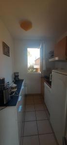 Kuchyň nebo kuchyňský kout v ubytování Résidence Claire Rive appartement 16 + 3 fotografie