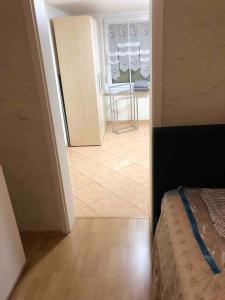 a view of a room with a bed and a mirror at Pension Ute in Strehla