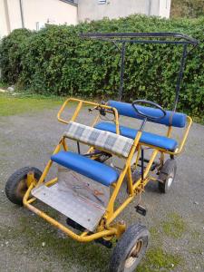 a yellow trike with blue chairs on it at STUDIO indépendant Segré in Segré +4 photos