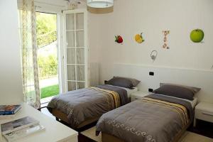 Postel nebo postele na pokoji v ubytování Villa Panoramica