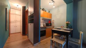 Η κουζίνα ή μικρή κουζίνα στο Hostdomus - Petit Bleu