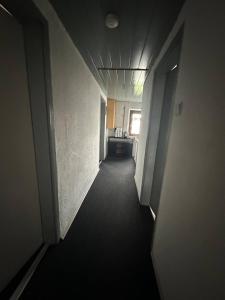 a hallway of an office building with a hallway at Corner Haus RM1 in Schnaittach