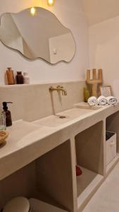 a bathroom with a sink and a mirror at Maison du Caboteur de La Baule, Centre & plage à pied, Patio cosy, 8 pers in Le Pouliguen +21 photos