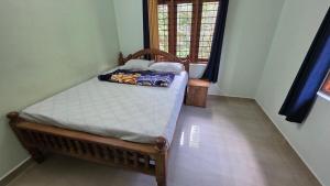 En eller flere senge i et værelse på Shajis Riverview Mansion