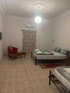 Ένα ή περισσότερα κρεβάτια σε δωμάτιο στο Motel EL Golla