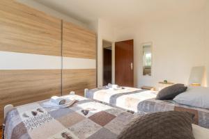 two beds sitting next to each other in a room at Casa Jurican in Višnjan +39 photos