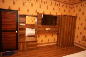 Ένα ή περισσότερα κρεβάτια σε δωμάτιο στο Kesariya Bagh