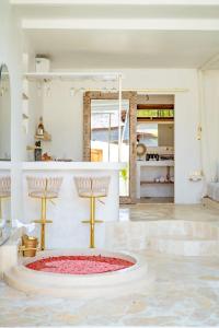 a large room with a large red rug in the middle at Marghe 1BR Romantic Villa, 5 Mins to Thomas Beach in Badung