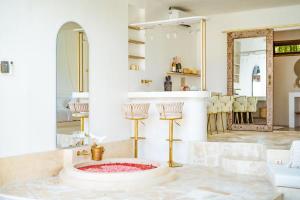 a bathroom with a large mirror and a sink at Marghe 1BR Romantic Villa, 5 Mins to Thomas Beach in Badung +18 photos