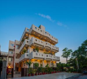 a large white building with lights on it at R41 - Boutique Hotel Vaishali Nagar Jaipur in Jaipur