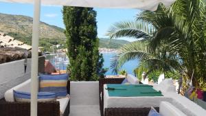 a balcony with chairs and a view of the water at Buena Vis-ta Apartments with the Sea View in Vis