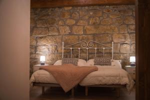 Ένα ή περισσότερα κρεβάτια σε δωμάτιο στο Arrutela