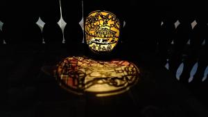 a mask sitting on a table in a dark room at Studio avec vue splendide sur les Diablerets in Les Diablerets +57 photos
