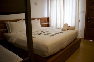 Postel nebo postele na pokoji v ubytování Oshi Boutique + 36 fotografií