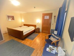 TV a/nebo společenská místnost v ubytování Urfter Hof Garni