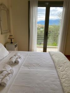 Ένα ή περισσότερα κρεβάτια σε δωμάτιο στο Aeria View