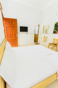 Postel nebo postele na pokoji v ubytování Phát Đại Nam Motel