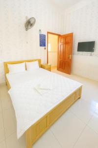 Postel nebo postele na pokoji v ubytování Phát Đại Nam Motel