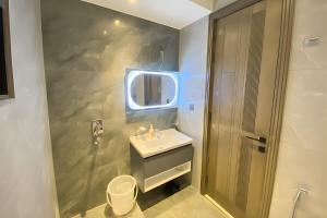a bathroom with a sink and a mirror at Monal Murree Luxury Studio with Private Parking in Murree