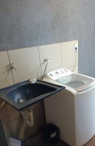 a bathroom with a sink and a toilet at VERTT Engenharia in Campo Grande +16 photos
