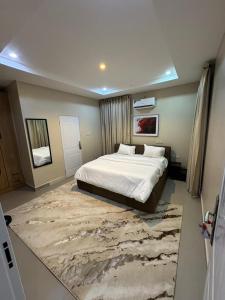 Ένα ή περισσότερα κρεβάτια σε δωμάτιο στο Suris Hospitality