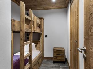 a bedroom with two bunk beds and a desk at Appartement Neuf à Courchevel Le Praz - 8 Couchages, Proche Pistes, Terrasse Ensoleillée - FR-1-568-3 in Courchevel +8 photos