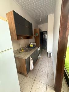 Køkken eller tekøkken på Microcasa Aconchegante, tudo para sua hospedagem! + 2 billeder