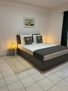 a bedroom with a large bed with two pillows at Apartmani Gagi in Vir