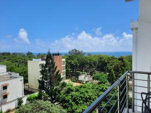 a view of the ocean from the balcony of a building at Ocean waves in Mombasa