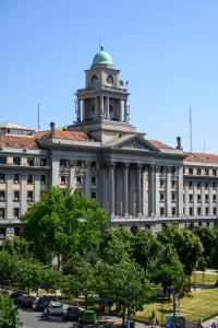 a building with a clock tower on top of it at Belgrade CITY CENTER Apartments in Belgrade