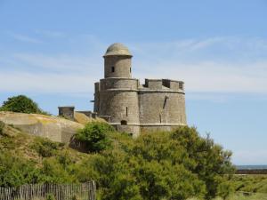 an old castle on top of a hill at L Eucalyptus in Aumeville-Lestre