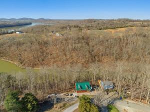 an aerial view of a house with a green roof at Little blue house on the lake in Nancy