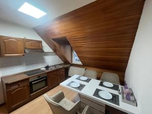a small kitchen with a table and chairs in it at Apartment Airport Dortmund in Holzwickede