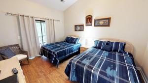 Postel nebo postele na pokoji v ubytování Club Villas Unit 19C Villa