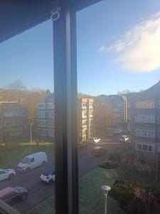 a view of a parking lot from a window at Open space studio in Shawlands in Glasgow