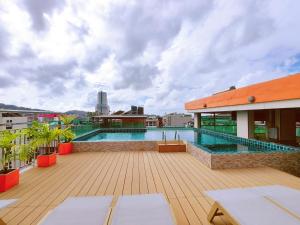 a swimming pool on the roof of a building at Phuket Patong Buri Resort in Patong Beach