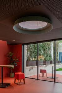 a room with a table and two chairs and a ceiling at Colegio Mayor Resa La Concepción in Valencia