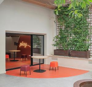 a restaurant with tables and chairs in front of a window at Colegio Mayor Resa La Concepción in Valencia +35 photos