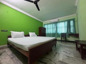 Ένα ή περισσότερα κρεβάτια σε δωμάτιο στο GM Residency