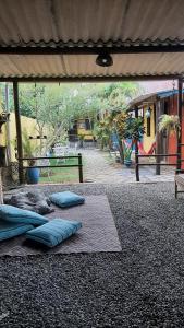 a group of pillows on the ground in a playground at Chalés Recanto da Aldeia in Itanhaém