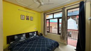 Ένα ή περισσότερα κρεβάτια σε δωμάτιο στο Ghar by the mountains