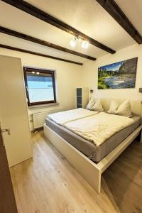 Ένα ή περισσότερα κρεβάτια σε δωμάτιο στο Apartment Am Hohen Bogen-38 by Interhome