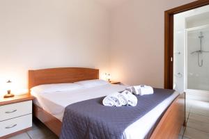 Ένα ή περισσότερα κρεβάτια σε δωμάτιο στο Mirto 2 Apartment