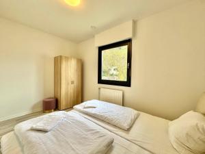 Postel nebo postele na pokoji v ubytování Villa Heusenstamm