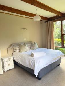 Postel nebo postele na pokoji v ubytování Jardin Villa