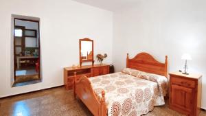 En eller flere senge i et værelse på Vista Pino